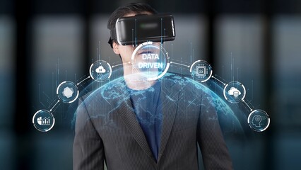 A young businessman in a virtual reality headset engaged in data-driven decision making, exploring innovative technology concepts in a modern office environment. Raster