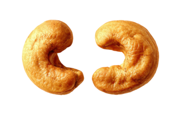 Two golden brown cashew nuts isolated on transparent background. Two golden cashew nuts isolated on white background.