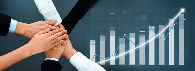Diverse hands come together in unity above a digital graph, symbolizing teamwork and growth in business performance with a positive financial trend. Axiom