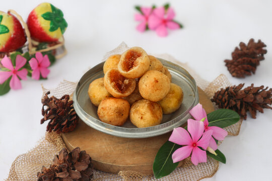 A plate of Indonesian deep-fried snacks, known locally as misro or jemblem. They are grated yuca (singkong) balls filled with melted palm s0000ugar. Sweet on the inside and crispy on the outside.