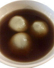 Isolated Black Sesame Dumplings in Ginger Syrup