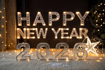 Happy New Year 2026 in backlit ice letters