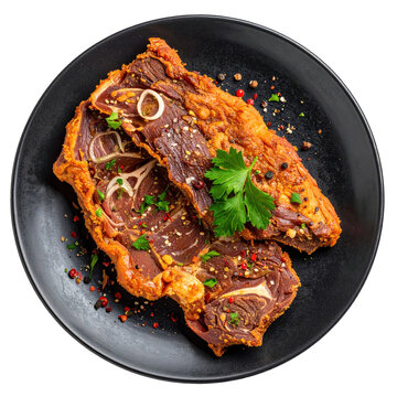Charque de llama traditional dried and salted llama meat from the andes sliced and presented on a board isolated on white background