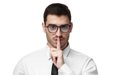 Young businessman pressing index finger to lips as if asking other to keep
