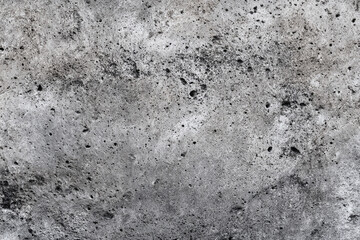 close up abstract texture of grey concrete with visible pores and imperfections