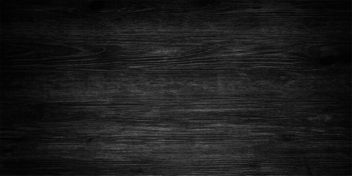 A dark grunge black chalkboard background with an old textured paper pattern and a rough aged surface for a vintage blank wall backdrop