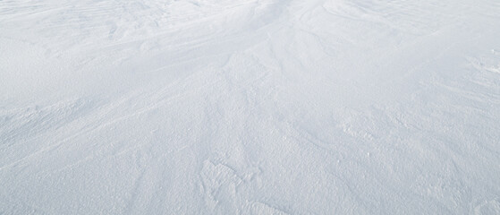 Snow abstract textured background with rough texture for design page template banner wallpaper or greeting card. © Aleksandr Matveev