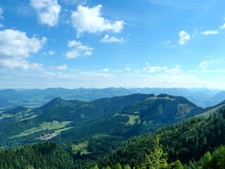 Naklejka premium Extensive Alpine panorama with forests, meadows, and mountains from the Kehlsteinhaus: Also called the Eagle's Nest. Copyspace.