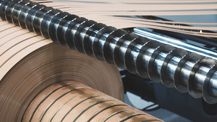 Industrial woodworking machine for gluing edges on the end of wood or chipboard furniture board, industrial furniture production concept background