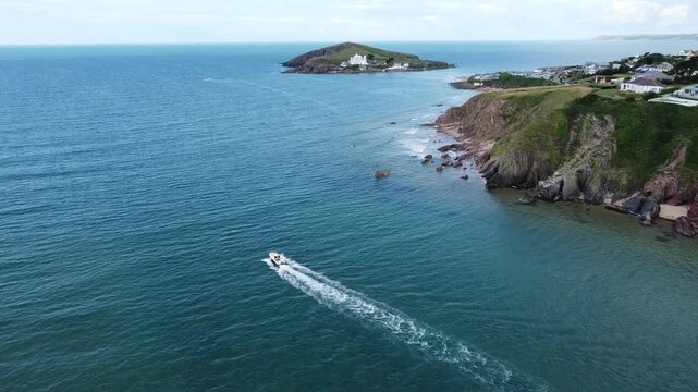 Aerial Drone Shot of Boat Leaving Bantham Estuary Toward Burgh Island, South Devon, England
