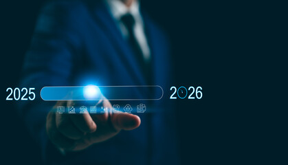New Year 2026 Business start-up to goals, A businessman touches taps start-up button 2025 to 2026...
