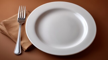 A fork and a plate with a white plate sit on a table