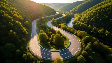 Aerial view of a winding road through a lush green valley, with a river and dense forests, bathed in warm golden light, depicting a picturesque journey