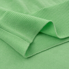 Elastic band of a light green knitted cotton polo t-shirt