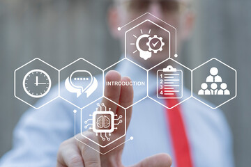 Introduction Business Finance Technology Internet Concept. Business person using virtual touch screen presses the word INTRODUCTION. Introduce new employees.