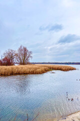 Walking along the calm embankment of the Dnypro in Obolon reveals soft autumn light and a peaceful riverside mood in Kyiv, Ukraine.