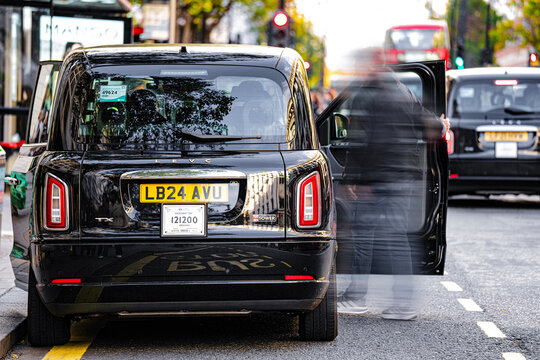 Black Cab Taxi (LEVC - London Electric Vehicle Company) Rear View, Oxford Street, Central London, England, United Kingdom &mdash; 1 November 2025