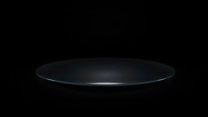 A sleek, dark, and reflective empty plate rests on a profound black background, creating a minimalist display for potential culinary artistry or a sophisticated product presentation