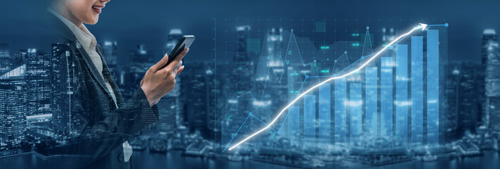 Business professional analyzing smartphone data trends against a futuristic city skyline with financial graphs illuminated at night Impute.