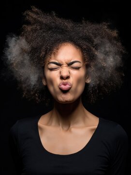 closeup portrait of angry young woman blowing steam coming out of ears about to have nervous atomic breakdown isolated black background negative human emotions facial expression feelings attitude no 