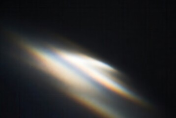 Subtle rainbow light leak effect creating an abstract colorful overlay or background