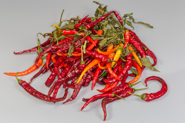 Fototapeta premium Heap of red chili pepper on a gray background