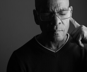 deafness suffering from deafness and hearing loss Senior man cupping his ear having difficulty hearing on gray background with people stock photo stock image