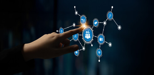 A person interacts with a digital interface featuring circular icons that symbolize networking and communication, showcasing modern technology and innovation. Tessel