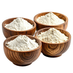 Four wooden bowls filled with various types of white and off-white flour isolated on black.