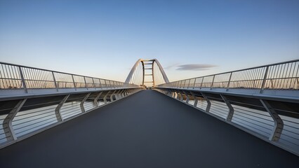 Obraz premium Modern Bridge Architecture at Sunset: Steel Structure, Cityscape, Golden Hour, Wide Angle View