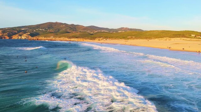 Guincho Beach, Green Mountains of Sintra and Cliffs Early Evening. Aerial View. Atlantic Ocean, Portugal. Orbiting