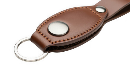 Closeup of a brown leather keychain with a metal snap button and key ring, isolated on transparent background