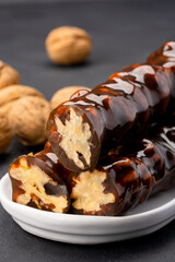 Walnut sausage dessert made with grape molasses and walnuts. Walnut sausage on black background
