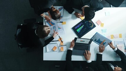 Top view of businesswoman bring financial statistic graph during meeting. Time lapse of smart manager putting tablet with investment data on table while business team brainstorming idea. Directorate. - Powered by Adobe