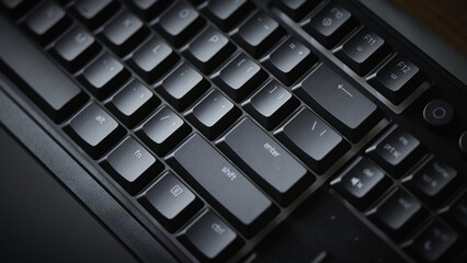 Close-up of Enter and Shift keys on a mechanical gaming keyboard with vibrant green RGB backlight