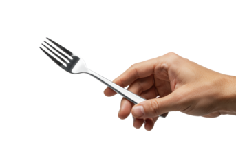 Tanned caucasian adult hand holding an elegant polished silver dessert fork on a transparent background with copy space. Concept of fine dining and luxury
