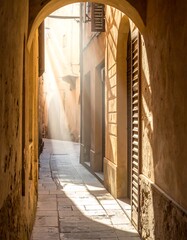 Sunbeams illuminating a narrow alleyway