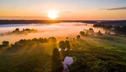 Sunrise over a misty landscape