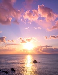 Sunrise over ocean, vibrant clouds