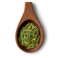 Aromatic dried herbal lemongrass tea on wooden spoon. Natural ingredient for cooking and healthy alternative medicine