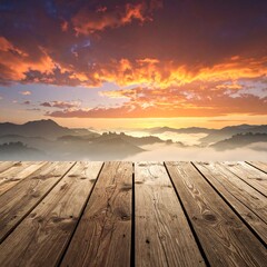 Sunrise over misty mountains from a wooden deck