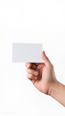 Fototapeta premium A hand holds a blank white business card against a plain background, symbolizing new beginnings and professional opportunities.