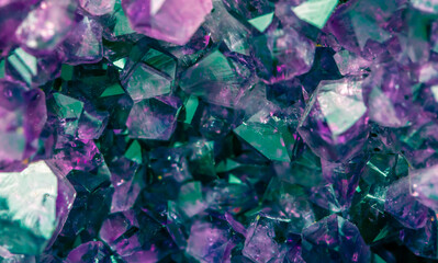 Obraz premium Multi-colored crystal mineral stone. Gems. Mineral crystals in the natural environment. Texture of precious and semiprecious stones. shiny surface of precious stone