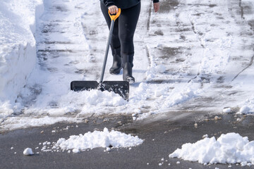 shoveling the snow on driveway