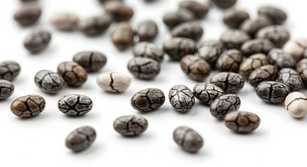 Obraz premium Extreme close-up of chia seeds showing their tiny, oval texture, isolated on white.