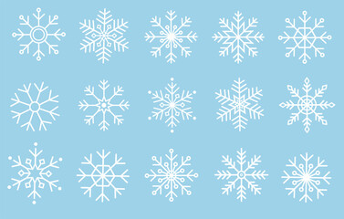 Big set of  different white snowflakes isolated on the blue background. 