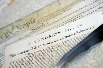 US Constitution with Declaration Of Independence and Quill Pen close up. Patriotism, Fourth of July background