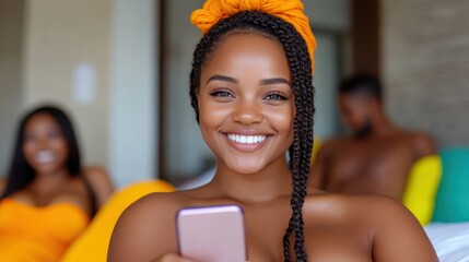 Smiling woman joyfully chatting on her phone in her cozy bedroom