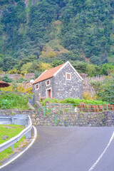Madeira, Portugal, 12.12.2025: Mountain road through green hills