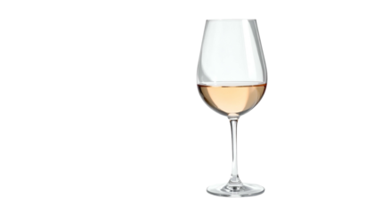 Elegant glass of blush wine stands against a stark black background